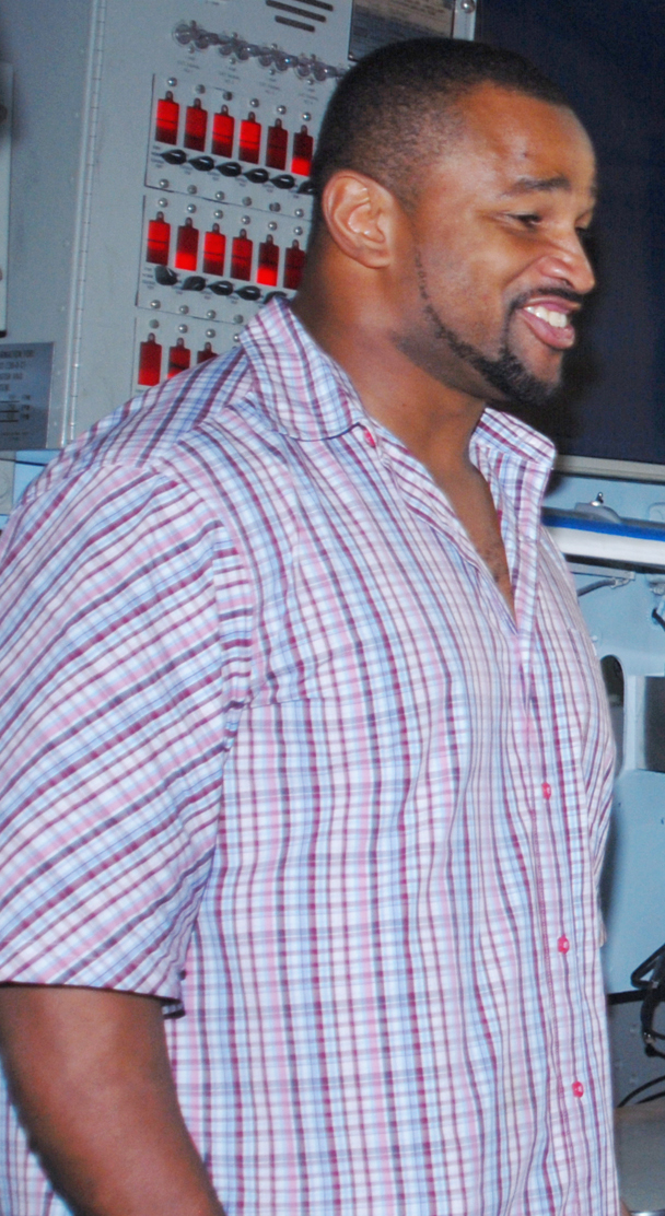 Lorenzo Neal sharing a laugh with a U.S. Navy sailor