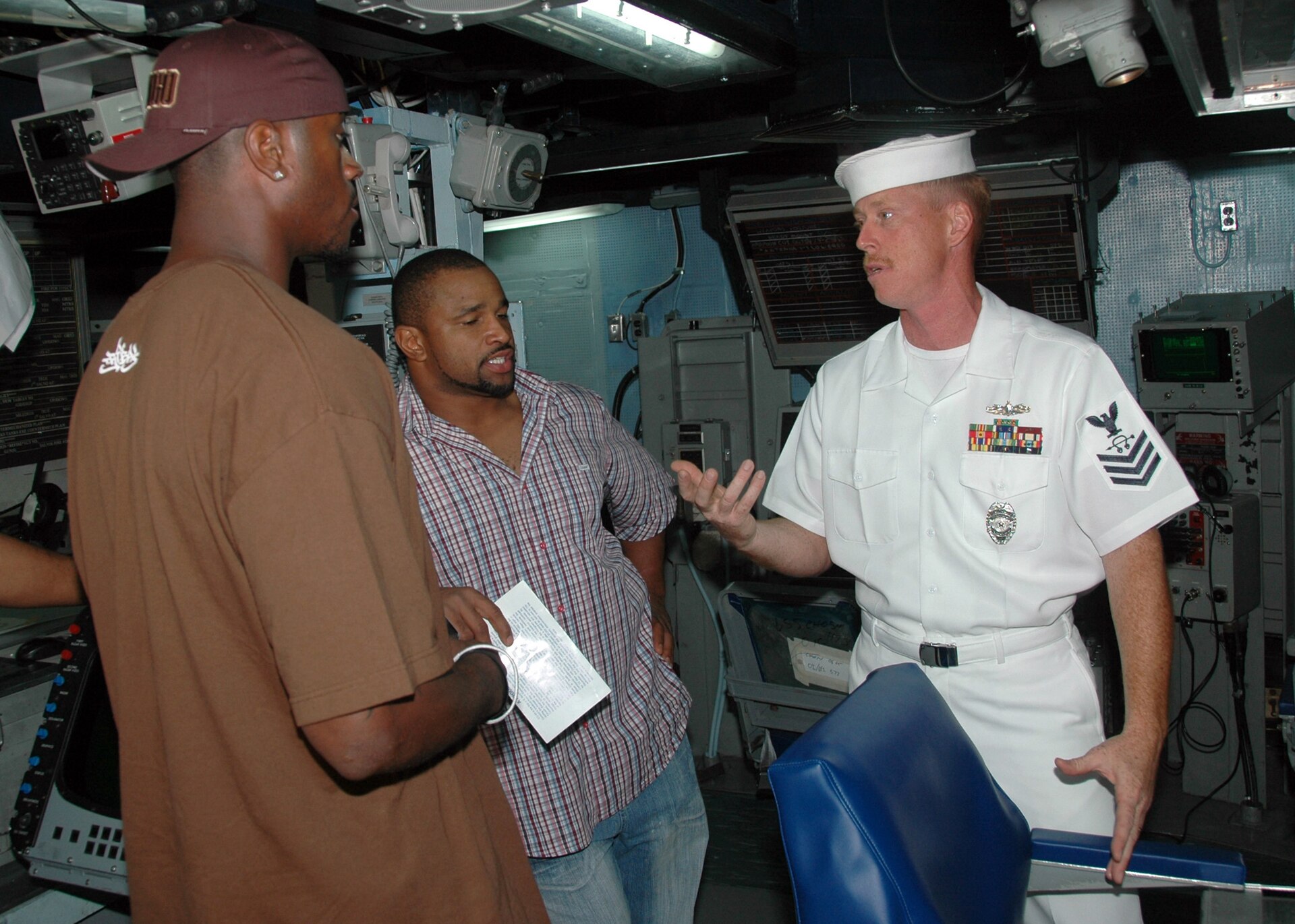 Lorenzo Neal, Kassim Osgood and Carlos Polk in the combat information center