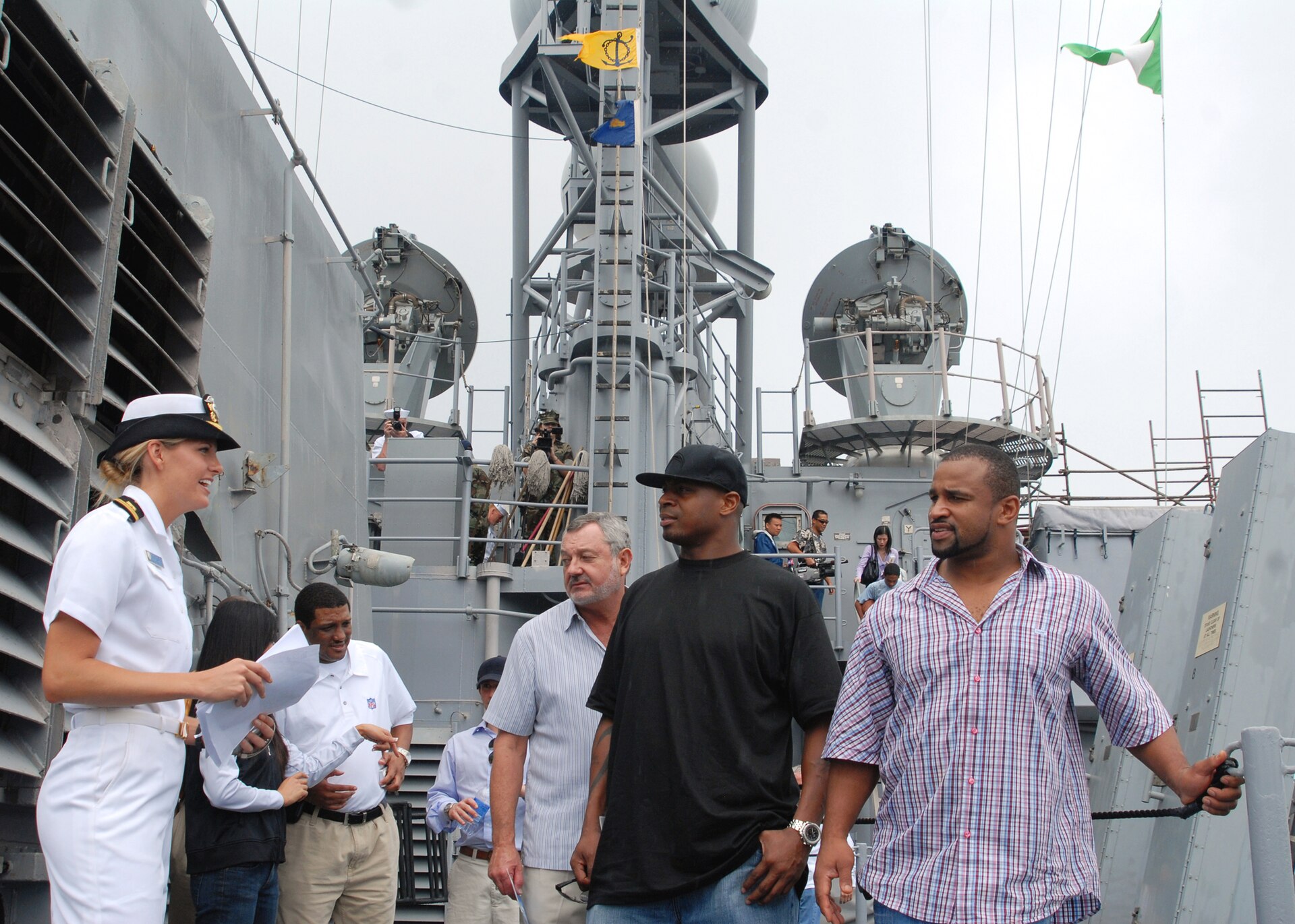 Lorenzo Neal and Chargers teammate Carlos Polk touring USS Chosin